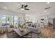Spacious living room with hardwood floors and seamless flow into the modern kitchen and dining areas at 1803 Ballard Rd # Holly Craftsman, Fuquay Varina, NC 27526