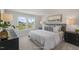 This bedroom features a large window, a comfortable bed, and matching black bedside tables for a calm atmosphere at 1803 Ballard Rd # Holly Craftsman, Fuquay Varina, NC 27526