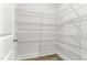 Walk-in pantry with metal shelves offers ample storage space and organization, and vinyl flooring at 1803 Ballard Rd # Holly Craftsman, Fuquay Varina, NC 27526