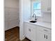 Pantry with white cabinets, white countertops, subway tile backsplash, and wire shelving at 1803 Ballard Rd # Holly Craftsman, Fuquay Varina, NC 27526