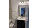 Bathroom with a modern vanity, mirror, and tiled shower at 1833 Fahey Dr, Apex, NC 27502