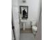 Cozy half-bathroom with hardwood floors, a sink, and a toilet at 1833 Fahey Dr, Apex, NC 27502