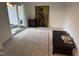Well-lit bedroom featuring a sliding glass door and neutral-colored carpet at 1833 Fahey Dr, Apex, NC 27502