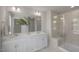 Bright bathroom featuring a double vanity, quartz countertops, and glass-enclosed shower at 1849 Ballard Rd # Holly Georgian, Fuquay Varina, NC 27526