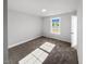 Bright bedroom featuring plush carpeting and a large window for natural light at 1849 Ballard Rd # Holly Georgian, Fuquay Varina, NC 27526