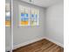 Bright bedroom with hard surface floors, neutral walls, and natural light at 1849 Ballard Rd # Holly Georgian, Fuquay Varina, NC 27526