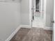 Walk-in closet with carpet flooring, shelving and doorway views to the hallway at 1849 Ballard Rd # Holly Georgian, Fuquay Varina, NC 27526