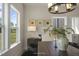 Bright dining area with a large window, modern lighting, and stylish decor elements at 1849 Ballard Rd # Holly Georgian, Fuquay Varina, NC 27526