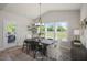 Elegant dining room with a wooden table, ample natural light, and a view of the outdoor patio at 1849 Ballard Rd # Holly Georgian, Fuquay Varina, NC 27526