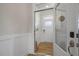 An interior entryway features a wood floor and white trim for a bright welcome into the home at 1849 Ballard Rd # Holly Georgian, Fuquay Varina, NC 27526