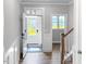 Inviting entryway with hard surface floors, white trim, and natural light at 1849 Ballard Rd # Holly Georgian, Fuquay Varina, NC 27526