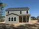 Exterior elevation of a two-story home with gray siding and an unfinished front yard on a bright, sunny day at 1849 Ballard Rd # Holly Georgian, Fuquay Varina, NC 27526
