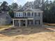 Charming two-story home with gray siding, black shutters, and a well-manicured lawn at 1849 Ballard Rd # Holly Georgian, Fuquay Varina, NC 27526