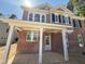 Brick front porch of the new home featuring classic white pillars at 1849 Ballard Rd # Holly Georgian, Fuquay Varina, NC 27526