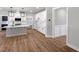 Modern kitchen with white cabinetry, stainless steel appliances, and a center island with pendant lighting at 1849 Ballard Rd # Holly Georgian, Fuquay Varina, NC 27526