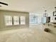 Spacious living room area with three large windows that provide an abundance of natural light at 1849 Ballard Rd # Holly Georgian, Fuquay Varina, NC 27526