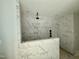 Modern marble shower featuring a rainfall shower head at 1849 Ballard Rd # Holly Georgian, Fuquay Varina, NC 27526