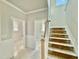 Open hallway with staircase and doorway view to rooms at 1849 Ballard Rd # Holly Georgian, Fuquay Varina, NC 27526