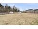Spacious backyard with shed and greenhouse fully enclosed by a wooden fence at 20 Patterson Dr, Angier, NC 27501