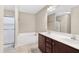 Bright bathroom featuring a double sink vanity, bathtub, and separate shower at 20 Patterson Dr, Angier, NC 27501