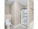 A clean bathroom featuring a toilet and shower with glass doors at 20 Patterson Dr, Angier, NC 27501