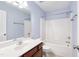 Inviting bathroom featuring a vanity sink, toilet, and shower tub at 20 Patterson Dr, Angier, NC 27501