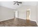 Spacious bedroom with vaulted ceiling, ceiling fan, bright window and wood-look flooring at 20 Patterson Dr, Angier, NC 27501