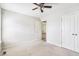 Light-filled bedroom featuring neutral carpet and dual closets at 20 Patterson Dr, Angier, NC 27501