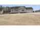 Charming single-Gathering home featuring blue shutters and a two-car garage on a well-maintained lawn at 20 Patterson Dr, Angier, NC 27501