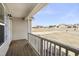 View from the covered front porch showing the neighborhood and surrounding greenery at 20 Patterson Dr, Angier, NC 27501