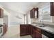 Gourmet kitchen with stainless appliances, wood cabinets, granite counters and breakfast nook at 20 Patterson Dr, Angier, NC 27501