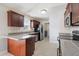 Updated kitchen with stainless appliances, wood cabinets, granite counters, and eat-in counter at 20 Patterson Dr, Angier, NC 27501