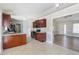 Open kitchen with stainless appliances, wood cabinets, granite counters and an eat-in counter at 20 Patterson Dr, Angier, NC 27501