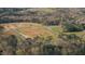 Aerial view of a new home development with roads and wooded area at 2005 Anna Lilley Dr # 53, Fuquay Varina, NC 27526