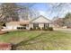 Charming ranch-style home with a well-manicured lawn and a two-car garage at 210 Long Crescent Dr, Durham, NC 27712