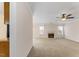 Spacious living room featuring plush carpeting, a fireplace, and natural light at 210 Long Crescent Dr, Durham, NC 27712