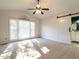 Spacious bedroom with vaulted ceiling, ceiling fan, and ensuite bathroom with sliding barn door at 2116 Leadenhall Way, Raleigh, NC 27603