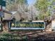 Trailwood Springs community sign featuring a brick base and gold lettering at 2116 Leadenhall Way, Raleigh, NC 27603