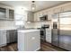 Modern kitchen featuring stainless steel appliances, updated cabinets and a stylish subway tile backsplash at 2116 Leadenhall Way, Raleigh, NC 27603