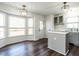 Well-lit breakfast nook area with hardwood floors, adjacent to modern kitchen with updated cabinets and stainless steel appliances at 2116 Leadenhall Way, Raleigh, NC 27603