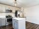Modern kitchen featuring stainless steel appliances, updated cabinets and a stylish subway tile backsplash at 2116 Leadenhall Way, Raleigh, NC 27603