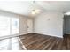 Inviting living room with vaulted ceiling, hardwood floors, large windows and lots of natural light at 2116 Leadenhall Way, Raleigh, NC 27603