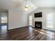 Inviting living room with vaulted ceiling, fireplace, hardwood floors, large windows and lots of natural light at 2116 Leadenhall Way, Raleigh, NC 27603