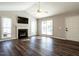 Inviting living room with vaulted ceiling, fireplace, hardwood floors, large windows and lots of natural light at 2116 Leadenhall Way, Raleigh, NC 27603