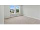 Empty bedroom with neutral carpet, a window view and white trim at 22 Whistling Way # 18, Lillington, NC 27546