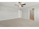 Spacious bedroom features neutral carpet, ceiling fan, and large doorways with view at 22 Whistling Way # 18, Lillington, NC 27546