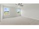 Spacious bedroom features neutral carpet, ceiling fan, and large windows with view at 22 Whistling Way # 18, Lillington, NC 27546