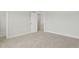 Empty bedroom with plush carpeting and a doorway at 22 Whistling Way # 18, Lillington, NC 27546