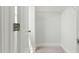 Bright closet featuring white walls, neutral carpeting, and a wire shelf for optimal storage solutions at 22 Whistling Way # 18, Lillington, NC 27546