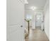 Bright entryway showcasing wood-look flooring, white walls, and staircase, creating a welcoming atmosphere at 22 Whistling Way # 18, Lillington, NC 27546